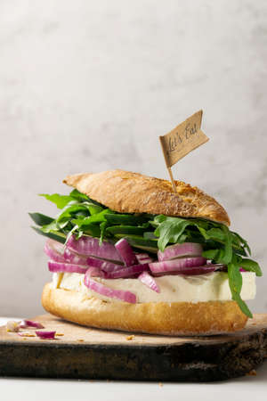 Homemade sandwich with goat cheese and fresh raw vegetablesの写真素材