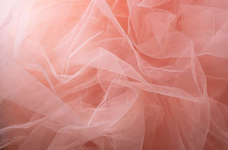 Pink tulle material background, pastel colors, romantic and delicate draperyの写真素材