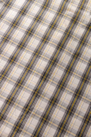 Classic geometric tweed fabric in gray and yellowの写真素材