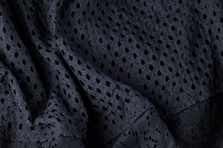 Fashionable black cloth, ondulate modern textile close up view