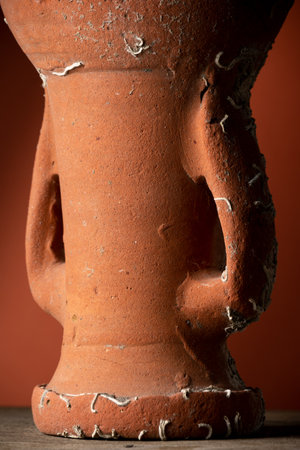 Old broken terracotta vase, handmade antique objectの写真素材