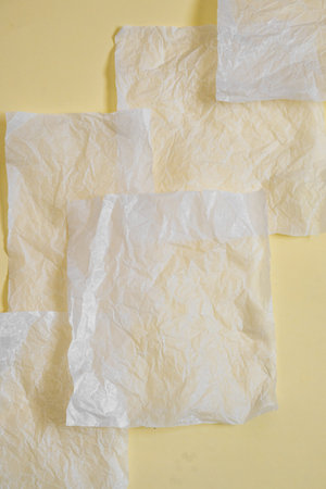 Neutral background with a white sheet of paper. Top view, clean minimal style in neutral colors, space for text.の写真素材