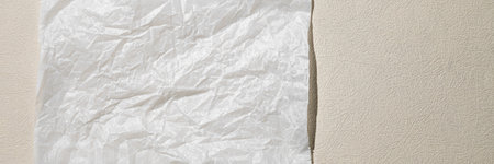 Neutral monochrome background with a white empty sheet of paper. Top view, clean minimal style in...