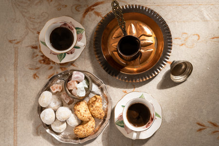 Turkish coffee with traditional sweets on antique carpetの写真素材