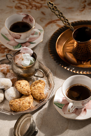 Turkish coffee with traditional sweets on antique carpetの写真素材