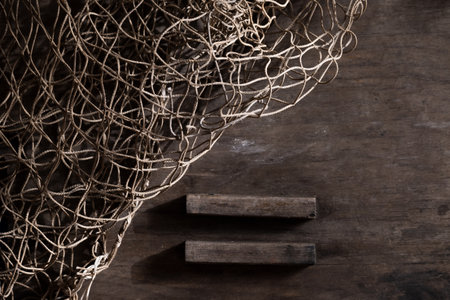Fishing net on rustic old wood, fishing concept, art craft themesの写真素材