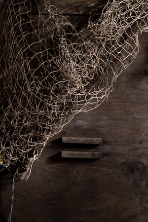 Fishing net on rustic old wood, fishing concept, art craft themes