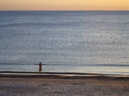 Beautiful winter sunset on the sandy beach of the Baltic Sea in Lithuania, Klaipeda