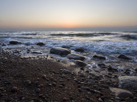 Beautiful sunset on the sandy beach of the Baltic Sea in Lietva, Klaipedaの写真素材