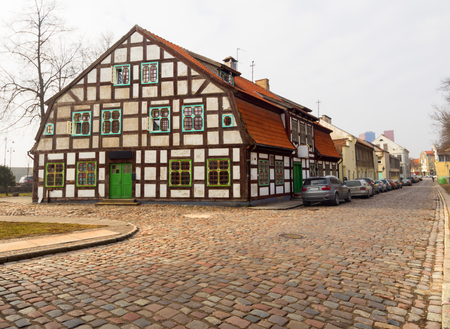 Old houses in the paved street of the Old Town of Klaipeda, Lithuaniaのeditorial素材