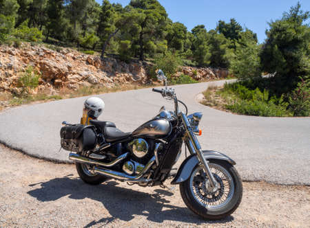 Central Greece, June 2020: Kawasaki Vulcan Motorcycle chopper stands on a mountain serpentine in Greeceのeditorial素材