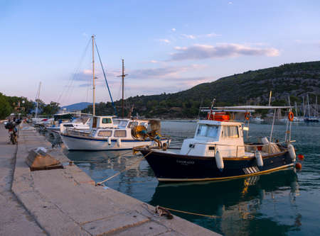Fishing boats stand in the marina of the resort town of Methana in the Peloponnese in Greeceのeditorial素材