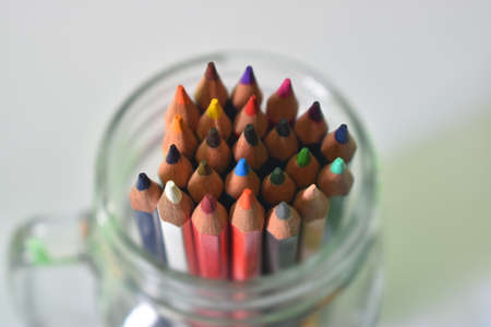 Colored pencils inside a glassの写真素材