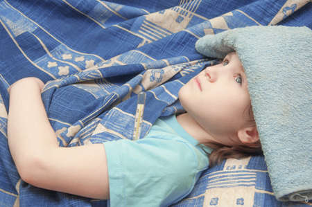 baby girl is sick with influenza. body temperature measurementの写真素材