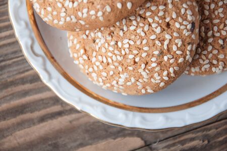 oatmeal cookies on a plate on a wooden background cropの写真素材