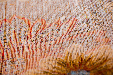 orange and brown a fabric texture backgroundの写真素材