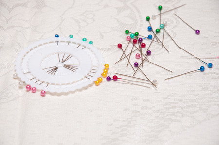 different colored pins on a light backgroundの写真素材