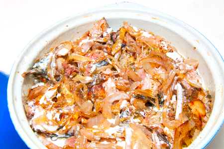 a fish stew in a ceramic baking dishの写真素材