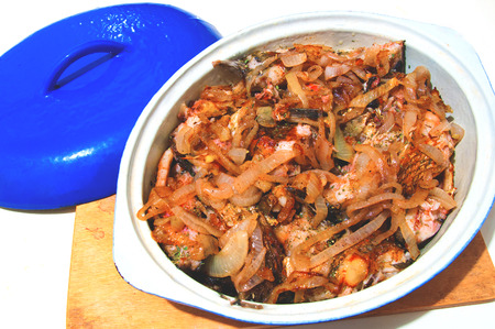 a fish stew in a ceramic baking dishの写真素材