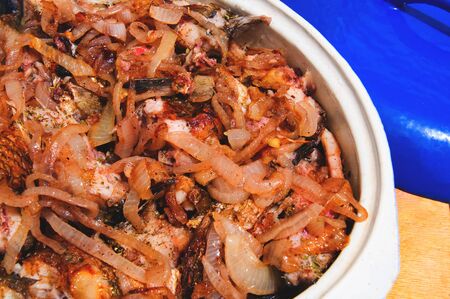 a fish stew in a ceramic baking dishの写真素材
