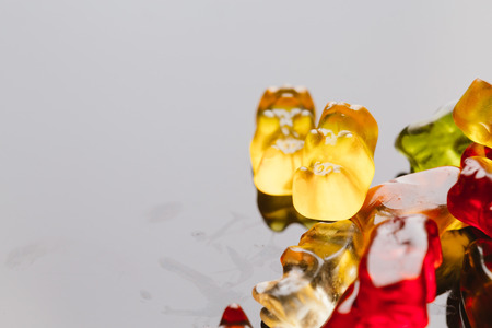 gummi bears close-up on a dark background.