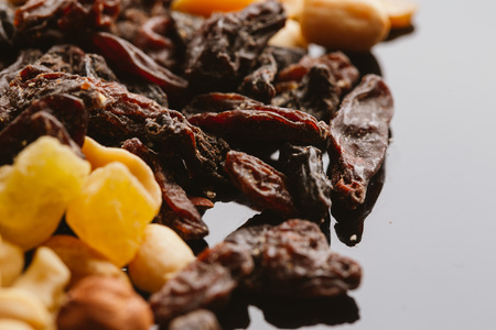 dried fruits close-up on a dark background close up.の写真素材