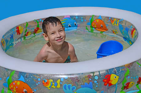 Smiling boy in the pool