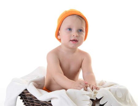 Child dressed as a pumpkin on a white backgroundの写真素材