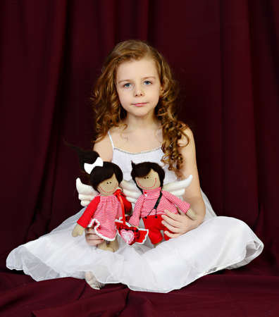 beautiful girl with a dollの写真素材