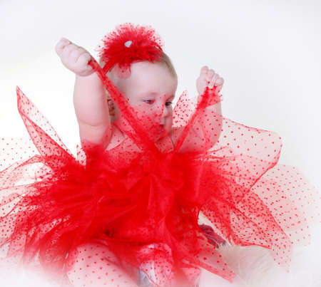 beautiful girl in a red skirt and headbandの写真素材