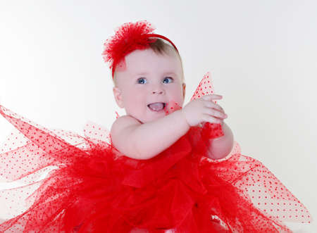 beautiful girl in a red skirt and headbandの写真素材