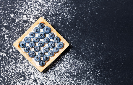 Delicious breakfast of blueberry cake and coffee in vintage cup withの写真素材