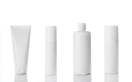 Blank cosmetic tubes on white background. White and silver colors. Place for your text. 