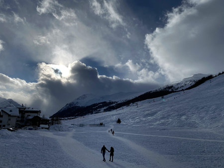 Winter weekend, sunny day. Ski resort. House in the mountains. Livigno, Italy