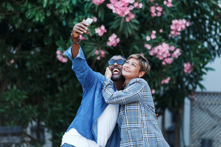 Happy Moments. Cheerful dark skin couple Taking shoot On camera While Having Romantic Date travel,...