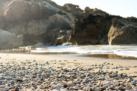 A close up view of smooth polished multicolored stones washed ashore on the beach. High quality photoの写真素材