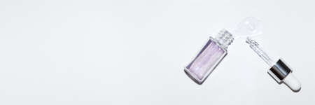 Cosmetic pipette with hyaluronic acid. Transparent gel with bubbles close-up. Gel cream or serum. A sample of a cosmetic product. Antibacterial gelの写真素材