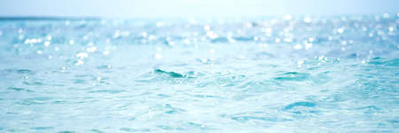 Abstract and blurred ocean or sea water with defocused bright sun light.の写真素材