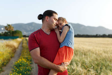 Happy father and child daughter spending time outdoors. Fathers Dayの写真素材