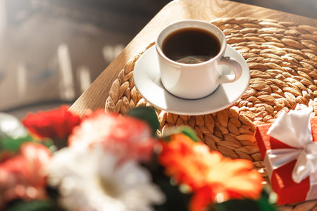 Coffee cup and gerbera flowersの写真素材
