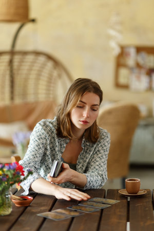 Card game as support for metaphorical representations, systemic Therapy. Psychologist woman having session with metaphorical associative cards.の写真素材