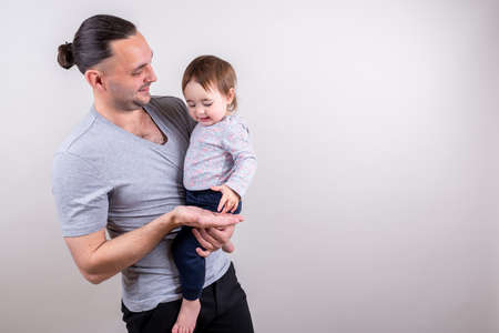 Young father holding daughter in his hands on Father's Day holidayの写真素材