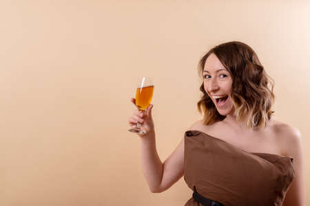 Young woman hat with orange drink ready for adventure close upの写真素材
