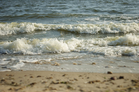 Stormy sea beach with waves flowing out
