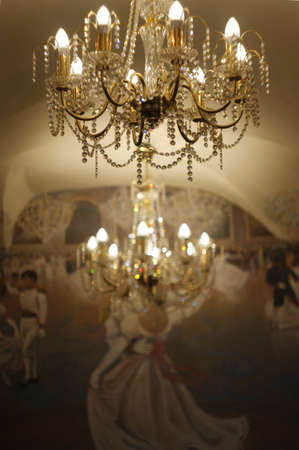 Elegant chandelier on the background of a painted wall of the Czech cafeのeditorial素材
