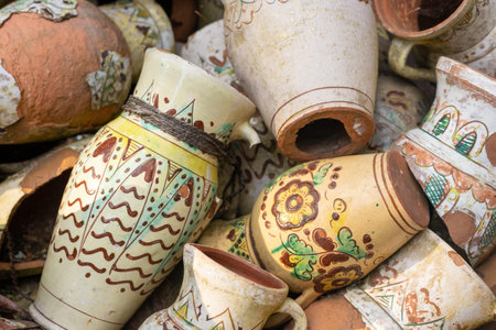Many Ukrainian ceramic vases, pots, jugs, pitchers with traditional decorative patterns. National...