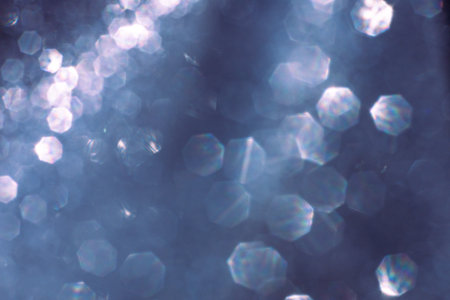 Abstract glitter lights textured blue and white background, de-focused, bokeh. Christmas or New Year...