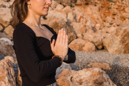 Close-up prayer hands, yoga meditation of woman outdoors for health and wellness. Zen chakra, pilates fitness and female yogi with namaste hand pose for praying, training and mindfulness exercise.の写真素材