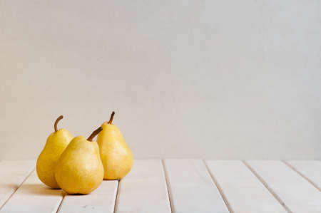 Yellow pears on the white tableの写真素材