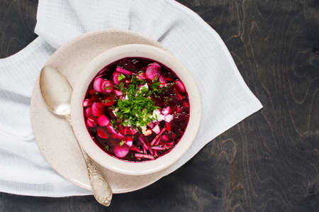 Summer vegetarian soup on the dark wooden tableの写真素材